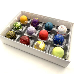 A Cacao Boys custom gift box of twelve hand-painted bonbons