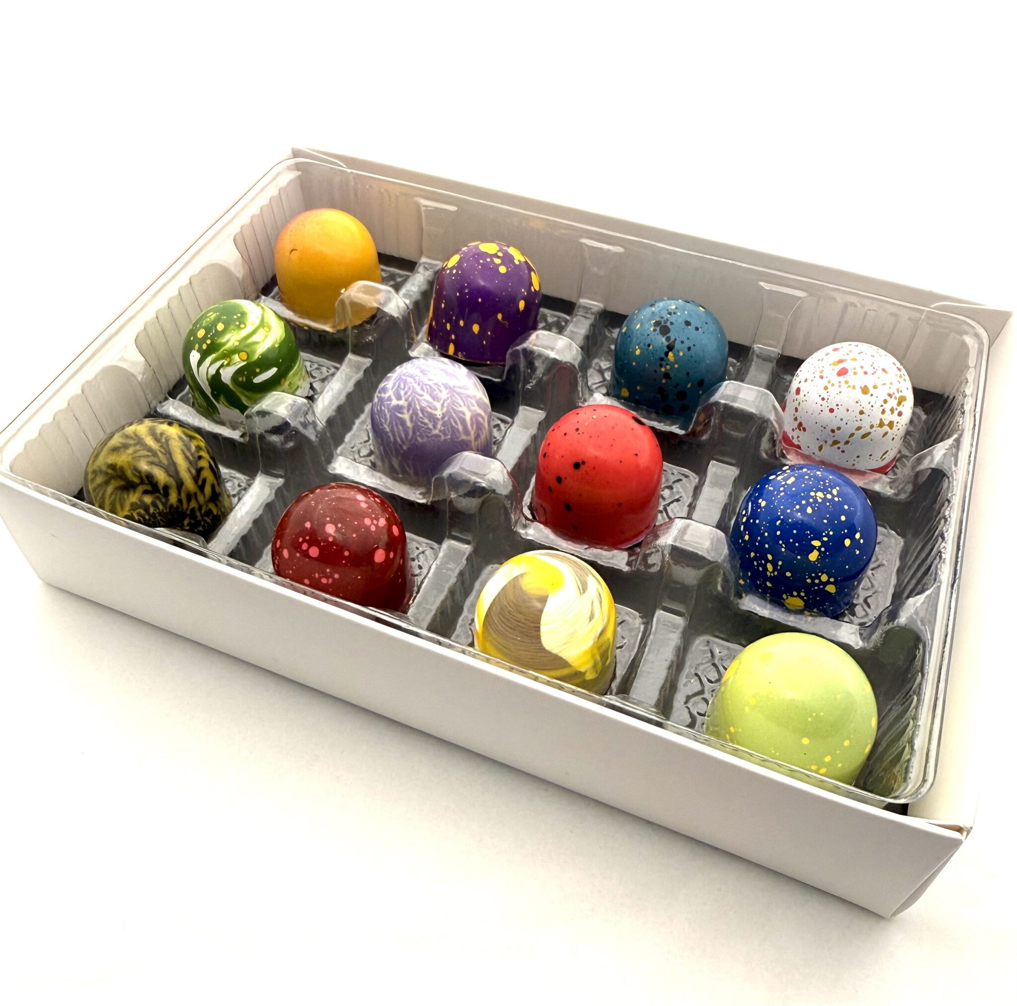 A Cacao Boys custom gift box of twelve hand-painted bonbons