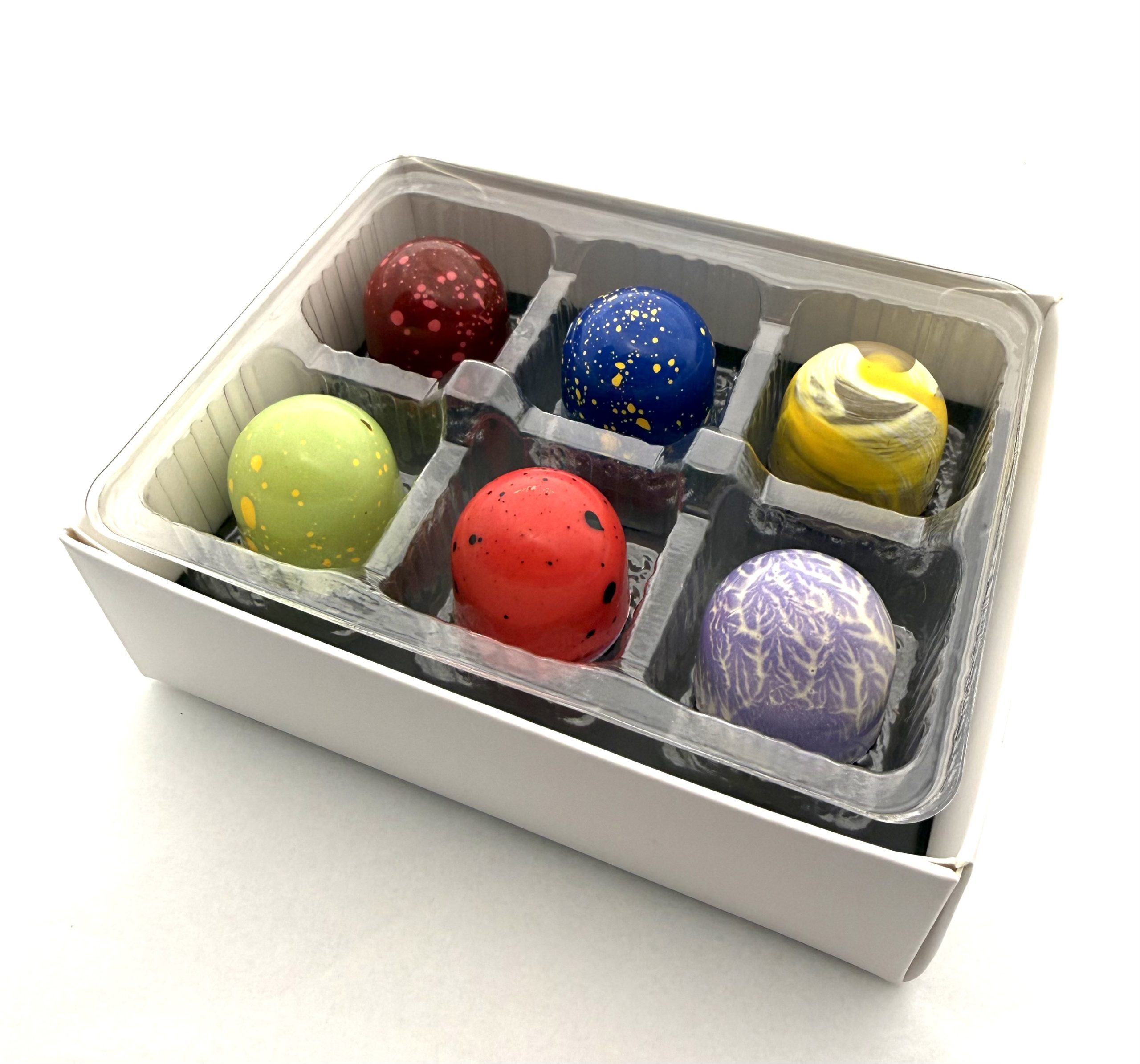 A Cacao Boys custom gift box of six hand-painted bonbons