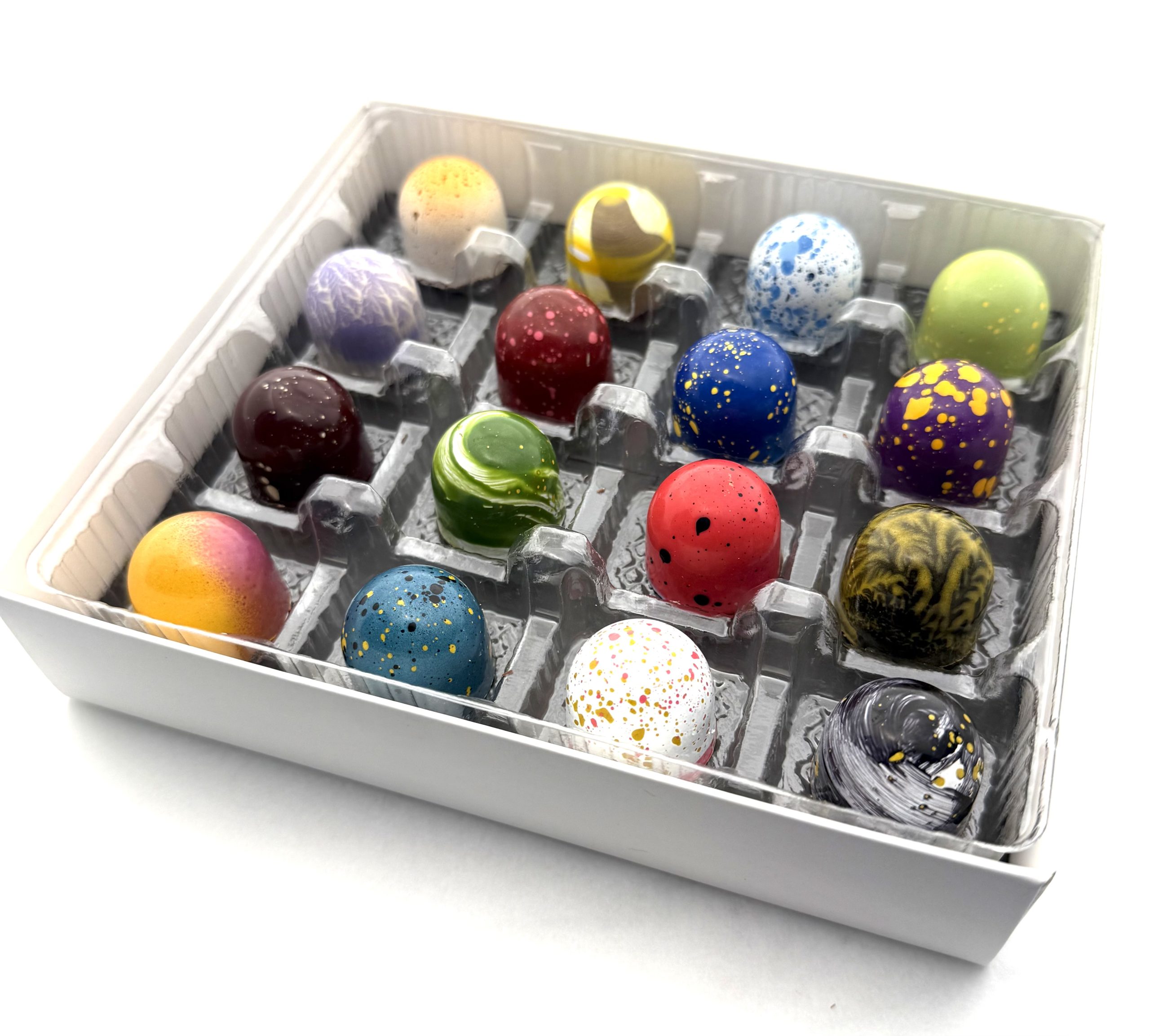 A Cacao Boys custom gift box of sixteen hand-painted bonbons