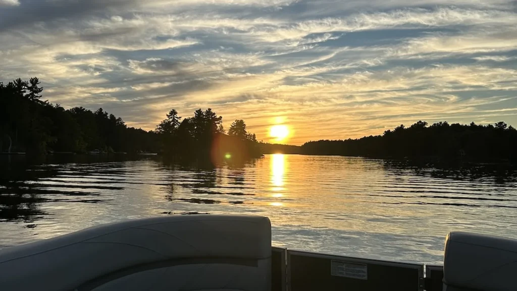 Sunset over a calm Muskoka lake